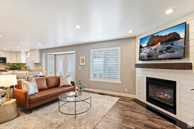 53 N Foxhill Rd N, North Salt Lake, UT 84054 - living area featuring recessed lighting, wood finished floors, and a large fireplace