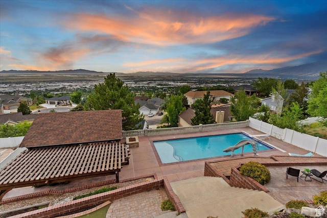 53 N Foxhill Rd N, North Salt Lake, UT 84054 - view of swimming pool with a fenced backyard, a mountain view, and a patio