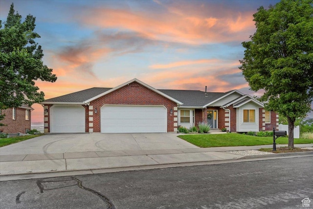 53 N Foxhill Rd N, North Salt Lake, UT 84054 - ranch-style house with a garage, brick siding, a front yard, and concrete driveway