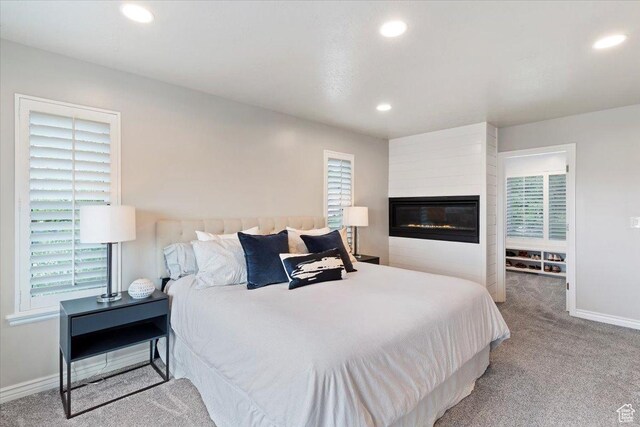53 N Foxhill Rd N, North Salt Lake, UT 84054 - bedroom featuring carpet, recessed lighting, multiple windows, and a large fireplace