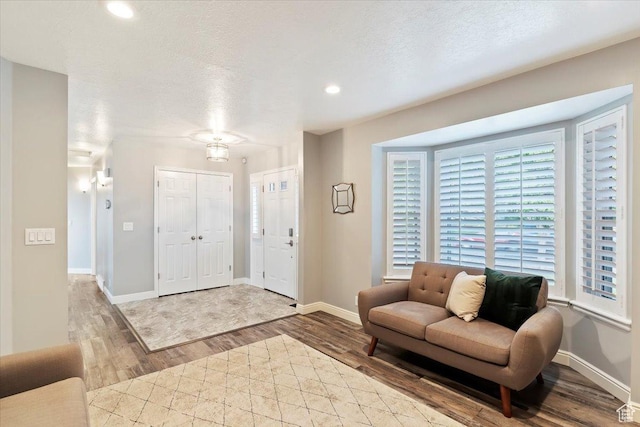 53 N Foxhill Rd N, North Salt Lake, UT 84054 - entryway featuring wood finished floors, recessed lighting, and a textured ceiling