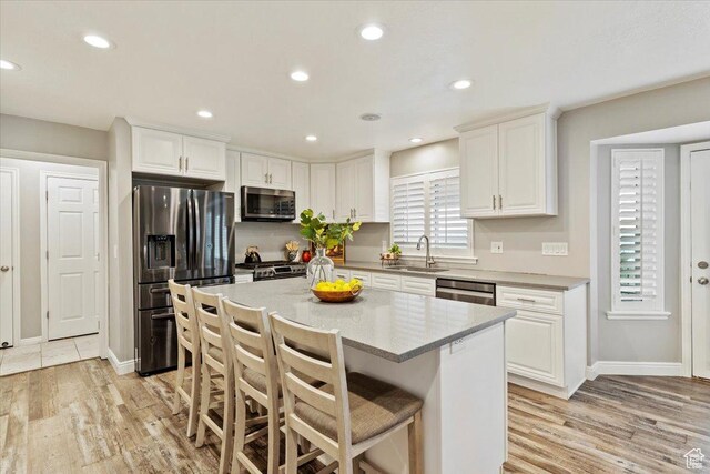 53 N Foxhill Rd N, North Salt Lake, UT 84054 - kitchen featuring stainless steel appliances, light wood-style floors, white cabinetry, and recessed lighting