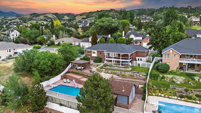 53 N Foxhill Rd N, North Salt Lake, UT 84054 - aerial view at dusk of a residential view and view of pool area