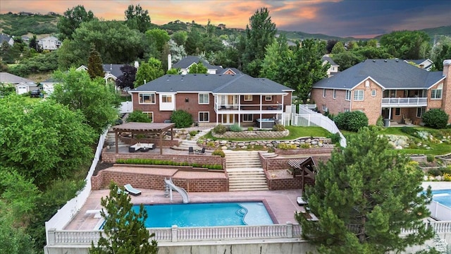 53 N Foxhill Rd N, North Salt Lake, UT 84054 - rear view of property with stairway, a pergola, a patio, and a balcony