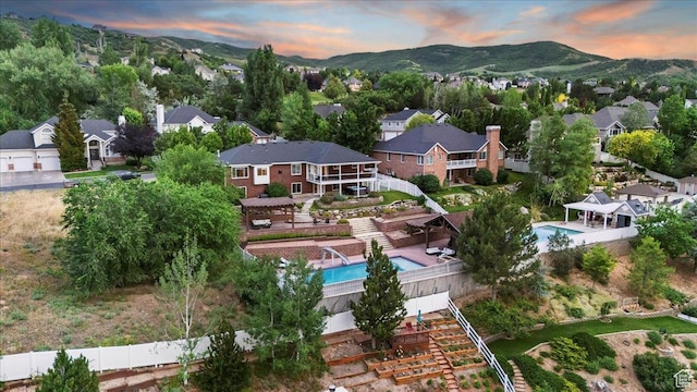 53 N Foxhill Rd N, North Salt Lake, UT 84054 - aerial perspective of suburban area featuring a pool area and a mountainous background