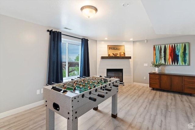 53 N Foxhill Rd N, North Salt Lake, UT 84054 - playroom with a fireplace, light wood-type flooring, and recessed lighting