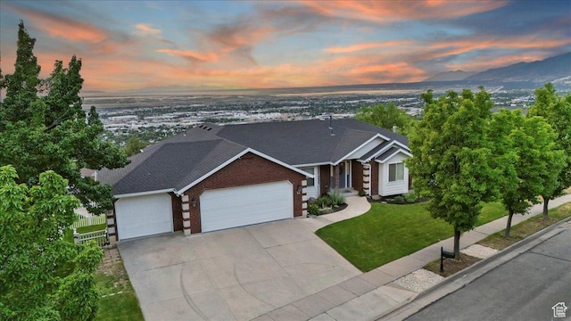 53 N Foxhill Rd N, North Salt Lake, UT 84054 - view of front of home featuring brick siding, an attached garage, and concrete driveway