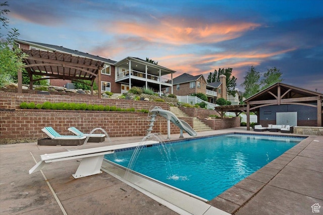 53 N Foxhill Rd N, North Salt Lake, UT 84054 - view of swimming pool featuring a water slide, a patio area, an outdoor living space, and a pergola