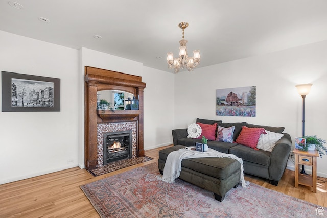 79 S 300 E, Farmington, UT 84025 - living area featuring wood finished floors, a chandelier, and a tile fireplace