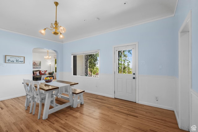 79 S 300 E, Farmington, UT 84025 - dining area with a chandelier, arched walkways, wood finished floors, wainscoting, and ornamental molding