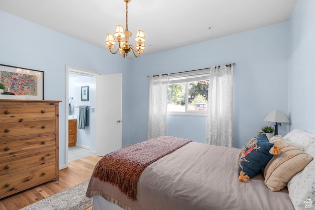 79 S 300 E, Farmington, UT 84025 - bedroom featuring light wood finished floors, a chandelier, and ensuite bath