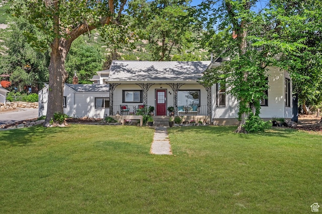 79 S 300 E, Farmington, UT 84025 - view of front of property featuring covered porch, roof with shingles, and a front yard
