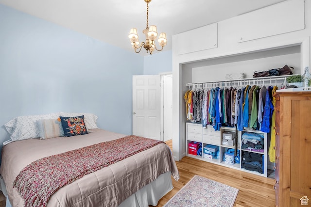 79 S 300 E, Farmington, UT 84025 - bedroom featuring a chandelier, wood finished floors, and a closet