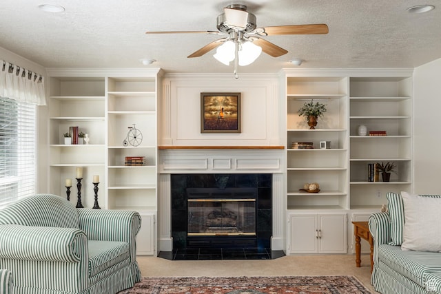 561 S Woodland Dr E, Farmington, UT 84025 - living area with light colored carpet, ceiling fan, a tiled fireplace, and a textured ceiling