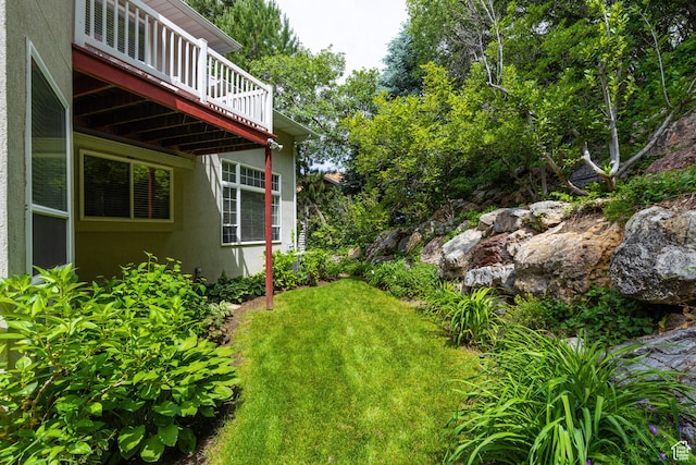 561 S Woodland Dr E, Farmington, UT 84025 - view of grassy yard with a deck