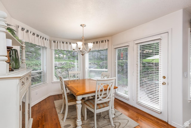 561 S Woodland Dr E, Farmington, UT 84025 - dining area with a chandelier and light wood-style floors