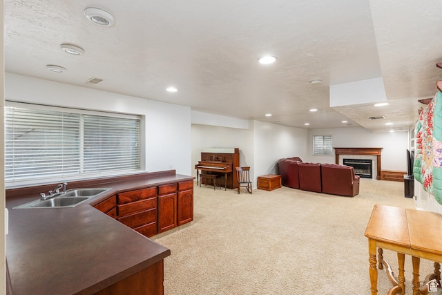 561 S Woodland Dr E, Farmington, UT 84025 - living room featuring light carpet, a glass covered fireplace, and recessed lighting