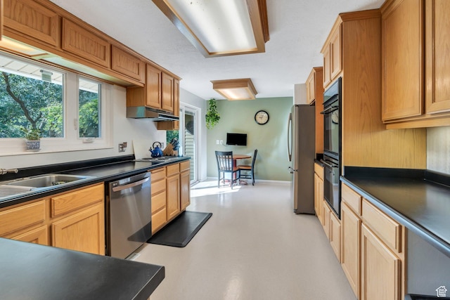 2173 S 1150 E, Bountiful, UT 84010 - kitchen featuring stainless steel appliances, dark countertops, and under cabinet range hood
