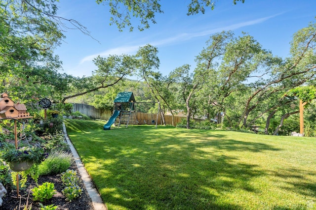 2173 S 1150 E, Bountiful, UT 84010 - fenced backyard with a playground