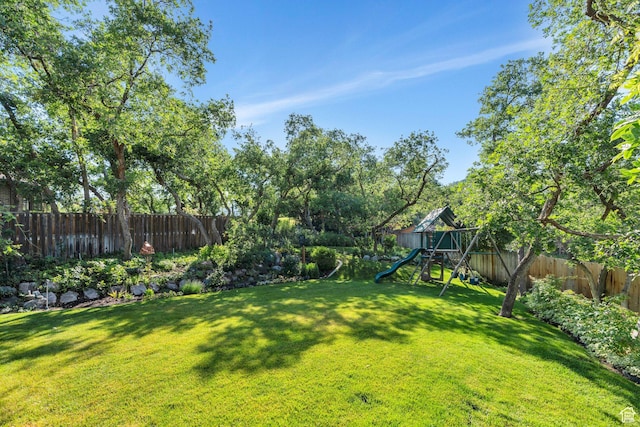 2173 S 1150 E, Bountiful, UT 84010 - fenced backyard with a playground