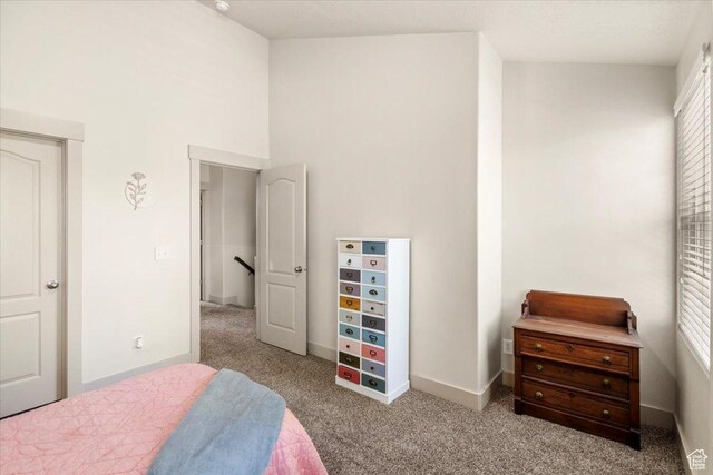 4257 W Lake Bridge Dr S, South Jordan, UT 84009 - carpeted bedroom with a high ceiling and multiple windows