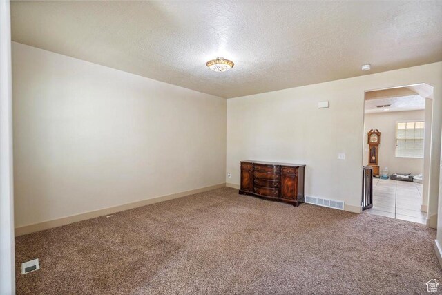 4257 W Lake Bridge Dr S, South Jordan, UT 84009 - unfurnished room featuring carpet flooring, a textured ceiling, and a smoke detector
