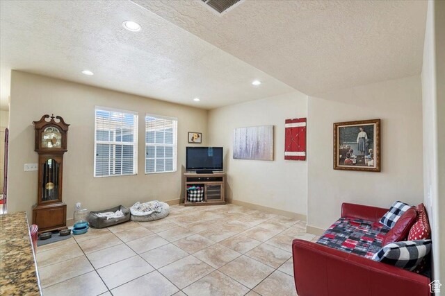 4257 W Lake Bridge Dr S, South Jordan, UT 84009 - living room with a textured ceiling, light tile patterned floors, and recessed lighting
