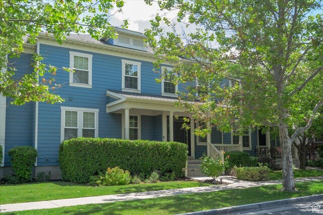 4257 W Lake Bridge Dr S, South Jordan, UT 84009 - traditional style home featuring covered porch and a front yard