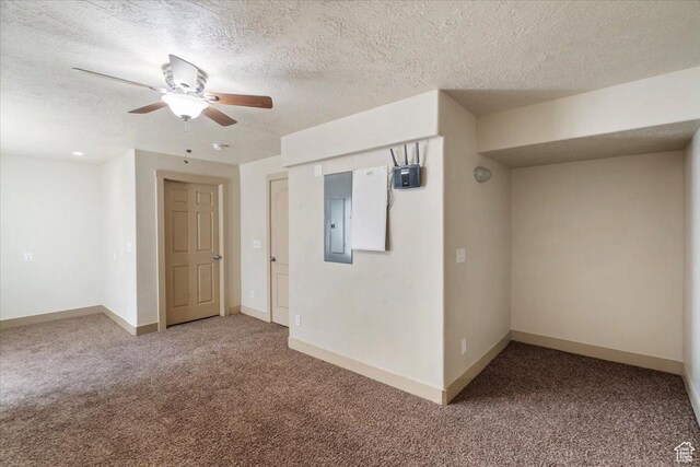 4257 W Lake Bridge Dr S, South Jordan, UT 84009 - spare room with carpet flooring, electric panel, a textured ceiling, and ceiling fan