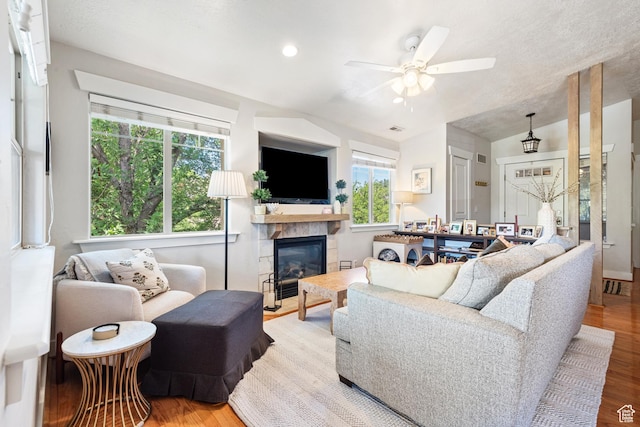 1692 E Kelmscott Ct S Unit C, Salt Lake City, UT 84124 - living area featuring ceiling fan, wood finished floors, lofted ceiling, a fireplace, and recessed lighting