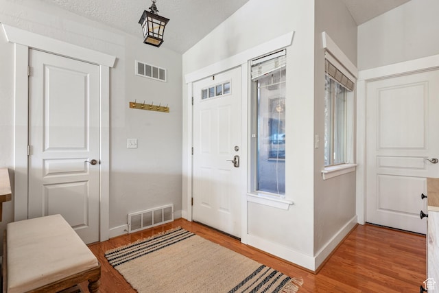 1692 E Kelmscott Ct S Unit C, Salt Lake City, UT 84124 - entryway featuring light wood-style floors and baseboards