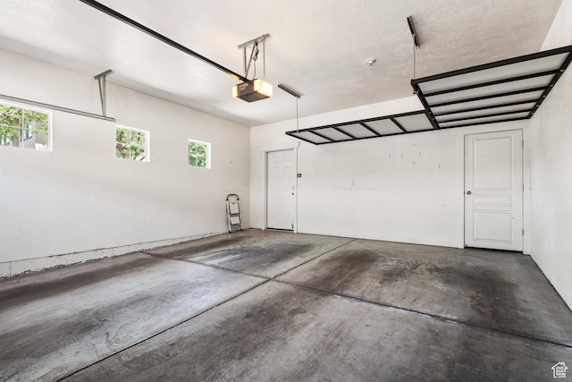 1692 E Kelmscott Ct S Unit C, Salt Lake City, UT 84124 - garage featuring a garage door opener