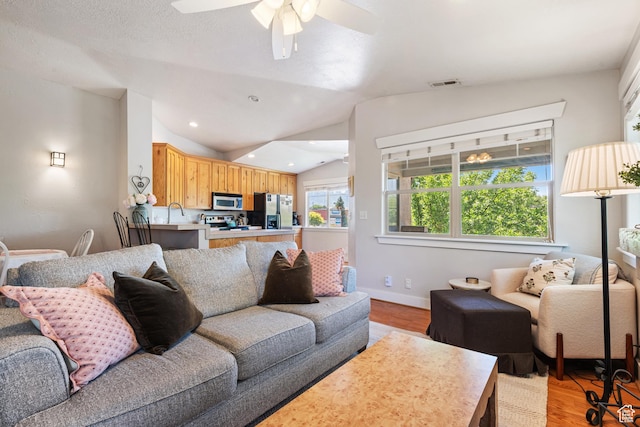 1692 E Kelmscott Ct S Unit C, Salt Lake City, UT 84124 - living area with light wood-type flooring, vaulted ceiling, a ceiling fan, and recessed lighting