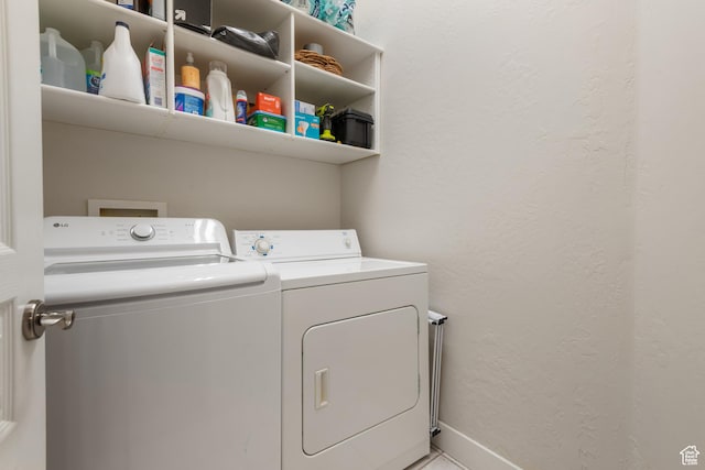 1692 E Kelmscott Ct S Unit C, Salt Lake City, UT 84124 - laundry room with washer and dryer and a textured wall