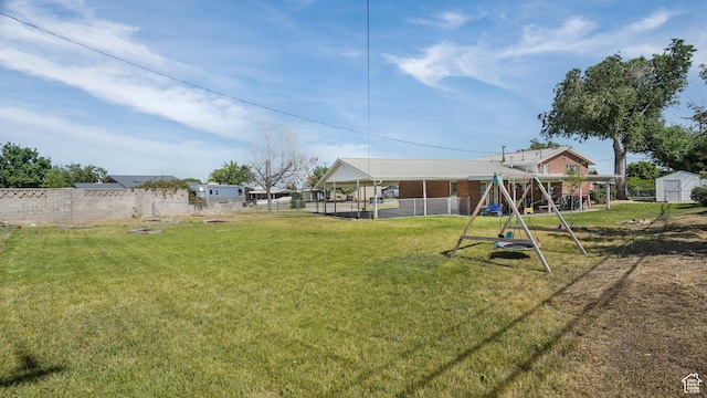 176 E Brook Ave N, Tooele, UT 84074 - view of yard featuring a playground