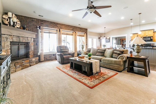 191 W Ranch Rd, Farmington, UT 84025 - living room featuring light colored carpet, ceiling fan, a stone fireplace, recessed lighting, and a chandelier