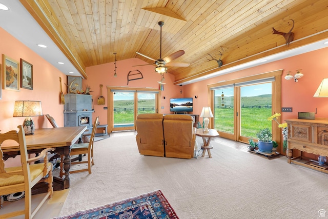 966 Mill Rd, Evanston, WY 82930 - carpeted living room featuring wooden ceiling, recessed lighting, lofted ceiling, a lit fireplace, and a ceiling fan