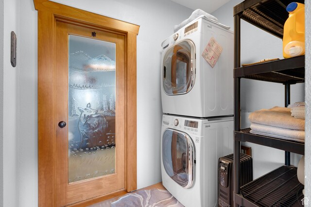 966 Mill Rd, Evanston, WY 82930 - laundry room with stacked washing machine and dryer