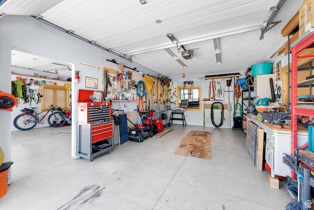 966 Mill Rd, Evanston, WY 82930 - garage featuring a workshop area and a garage door opener