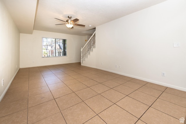 1735 W 540 N Unit 1303, St George, UT 84770 - unfurnished room with ceiling fan, light tile patterned flooring, and stairway