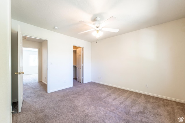 1735 W 540 N Unit 1303, St George, UT 84770 - unfurnished bedroom with carpet flooring, a spacious closet, a ceiling fan, and a closet