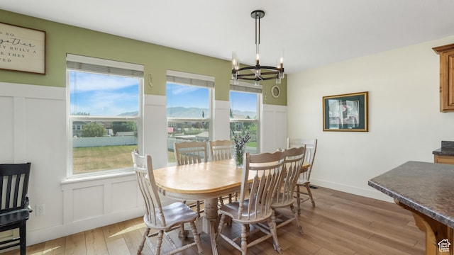 2201 W 1300 S, Lehi, UT 84043 - dining room with a decorative wall, a chandelier, light wood finished floors, and a wainscoted wall