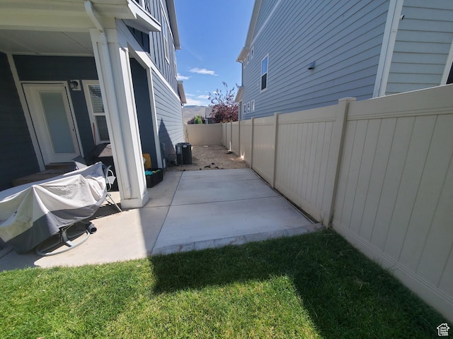 4973 E Oakwood Dr, Eagle Mountain, UT 84005 - fenced backyard featuring a patio area
