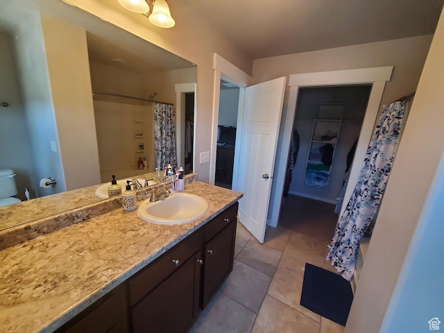 4973 E Oakwood Dr, Eagle Mountain, UT 84005 - full bathroom featuring vanity, a shower with shower curtain, and tile patterned floors