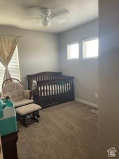 4973 E Oakwood Dr, Eagle Mountain, UT 84005 - carpeted bedroom with a nursery area and ceiling fan