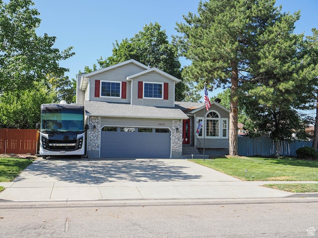 1402 E Valley Ridge Dr S, Sandy, UT 84093 - view of front of property with a garage, driveway, and stone siding