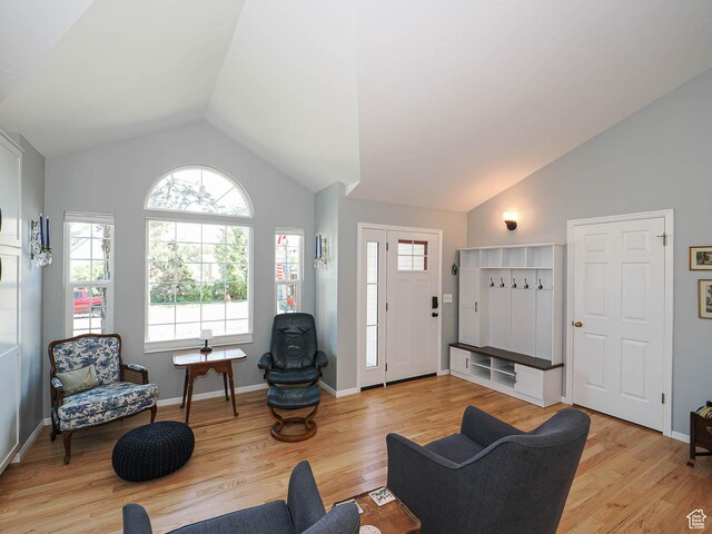 1402 E Valley Ridge Dr S, Sandy, UT 84093 - living room with healthy amount of natural light, light wood-style flooring, and high vaulted ceiling