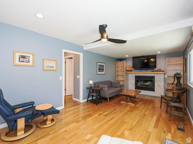 1402 E Valley Ridge Dr S, Sandy, UT 84093 - living room featuring a ceiling fan, light wood finished floors, a premium fireplace, and recessed lighting