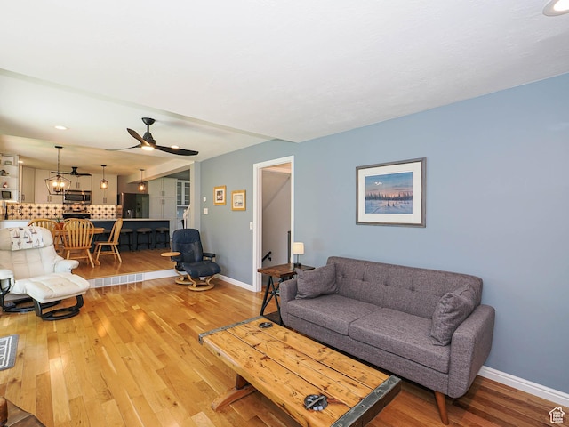 1402 E Valley Ridge Dr S, Sandy, UT 84093 - living area with light wood finished floors and ceiling fan