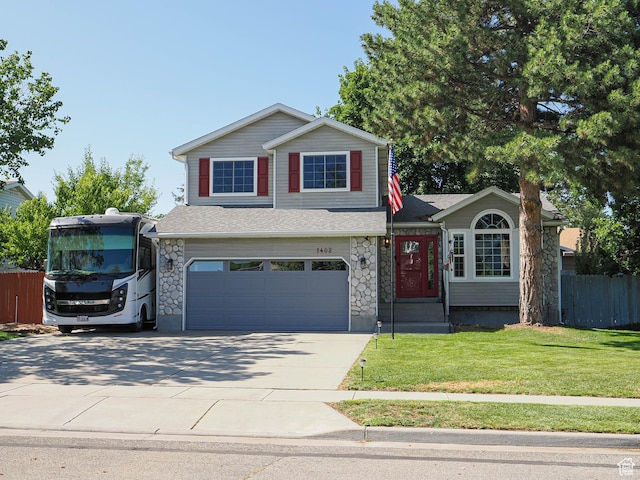 1402 E Valley Ridge Dr S, Sandy, UT 84093 - view of front of property featuring an attached garage, concrete driveway, stone siding, and a shingled roof